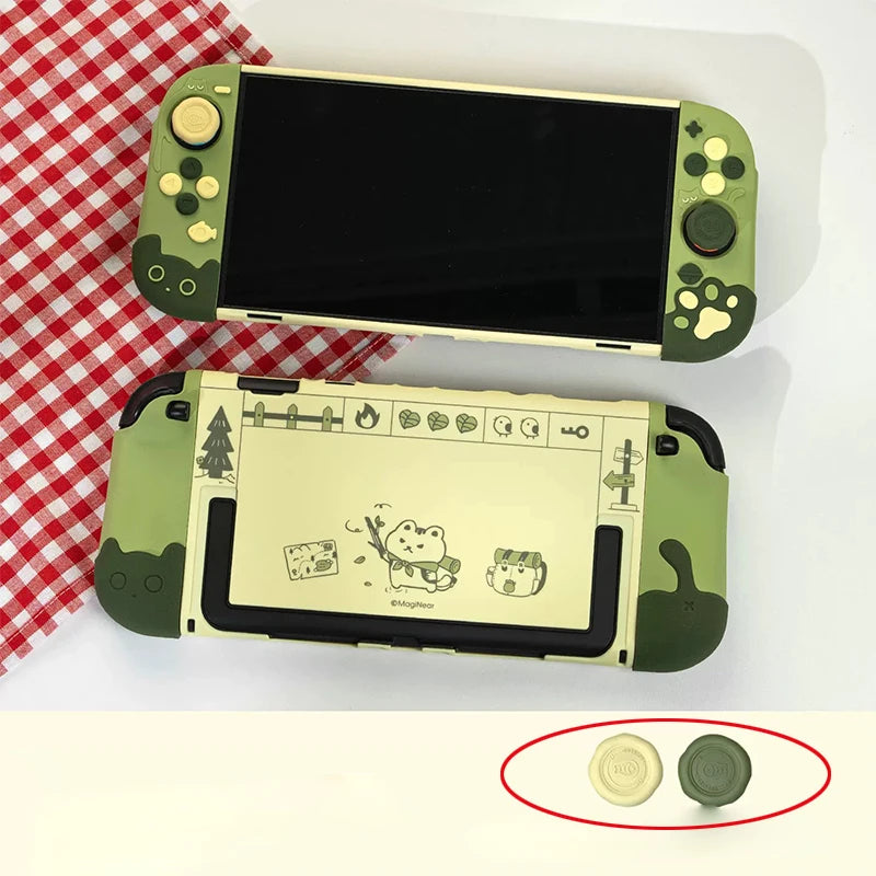 Green gaming console with cartoon designs on a white surface