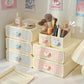 Kawaii pastel-colored storage drawers with cosmetic items on a desk