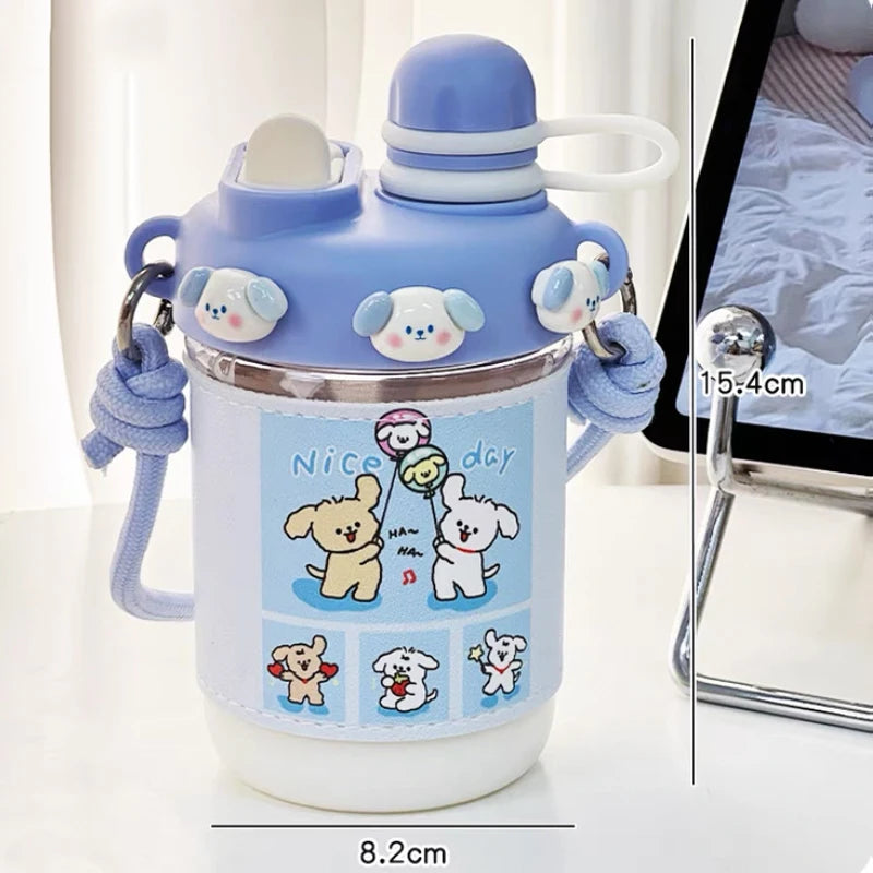  cute water bottle with cartoon designs held by hands against a blurred background. displaying the measurements of it.