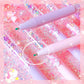Pink pen with decorative packaging on a pink glittery background