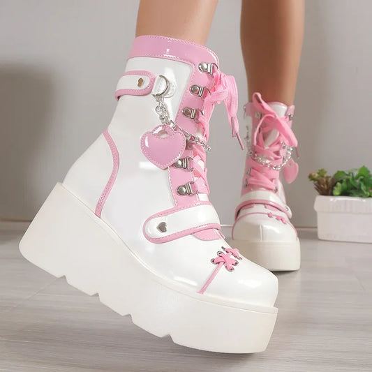 White platform boots with pink accents on a neutral background