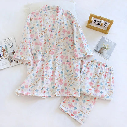 Floral pajama set on a white surface with a calendar in the background