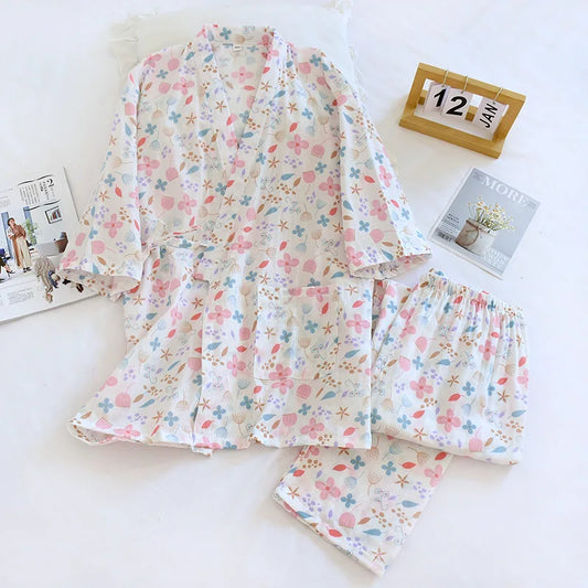 Floral pajama set on a white surface with a calendar in the background