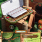 Open wooden tool box with compartments on a grassy background, featuring 'Ruralcat' branding.