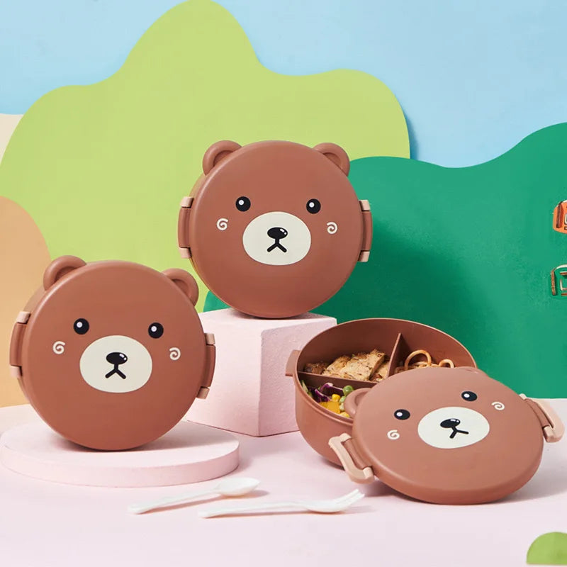 Three bear-shaped lunch boxes with a colorful background