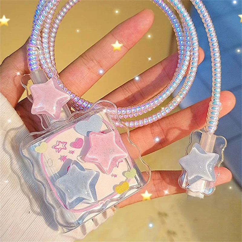 Star iphone charger cover with beaded strap held by a hand against a blurred background