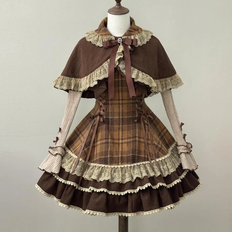 Brown and beige plaid dress with lace details on a mannequin against a plain background