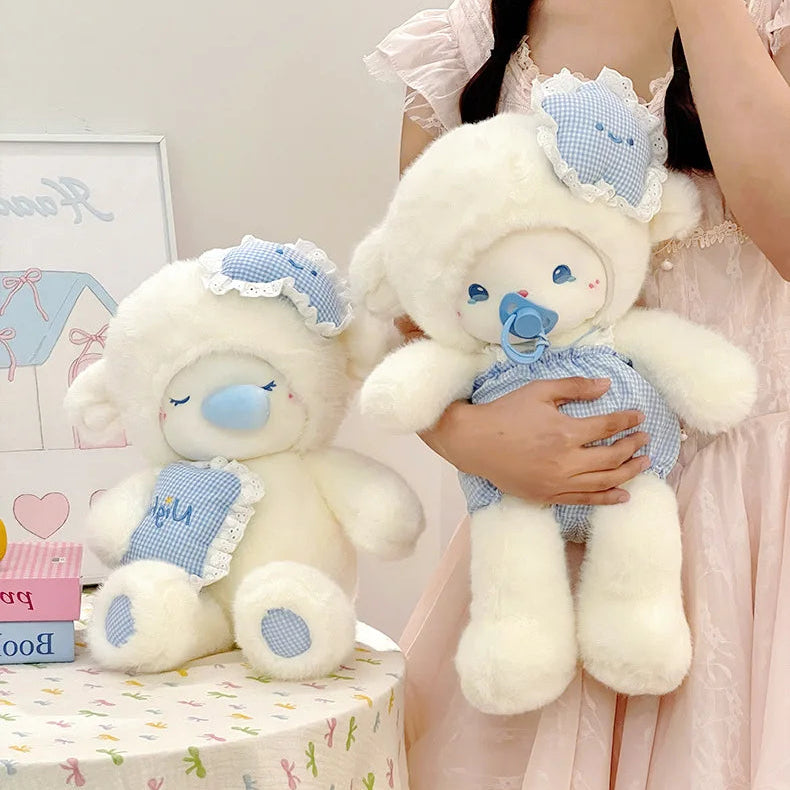 Person holding a lamb stuffed animal with a smaller one on a table in a room.