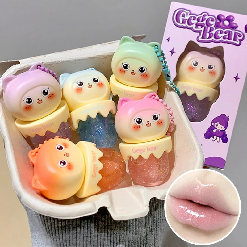 Set of colorful kawaii lip balms with 'Gege Bear' branding, displayed in a box.