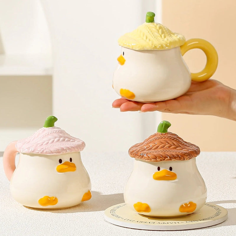 Hand holding Kawaii Duck Mug with Lids 