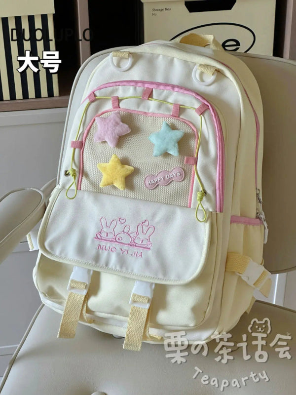 Kawaii backpack with star designs on a chair