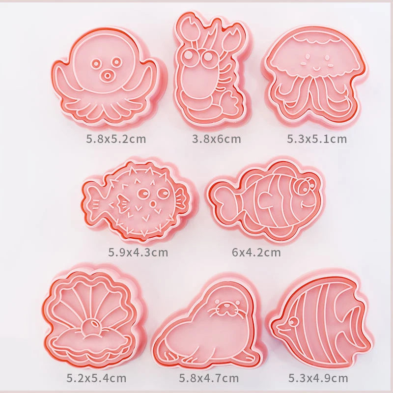 Set of pink sea creatures -shaped cookie cutters with dimensions displayed below each.