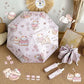 cat themed umbrella with cartoon designs on a textured surface