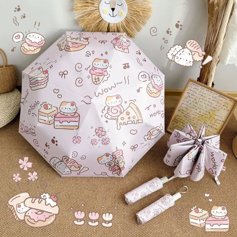 cat themed umbrella with cartoon designs on a textured surface