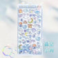 Transparent sheet with cute cartoon characters and designs on a light blue background