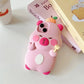 Pink capybara kawaii phone case on a white surface with books in the background