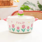 Kawaii pink Flower Ramen Bowl sitting on countertop with glass lid 