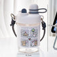  cute water bottle with cartoon designs held by hands against a blurred background. displaying the measurements of it.