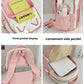 pink  neko backpack displayed by a white wall, showing the different storage compartments it has