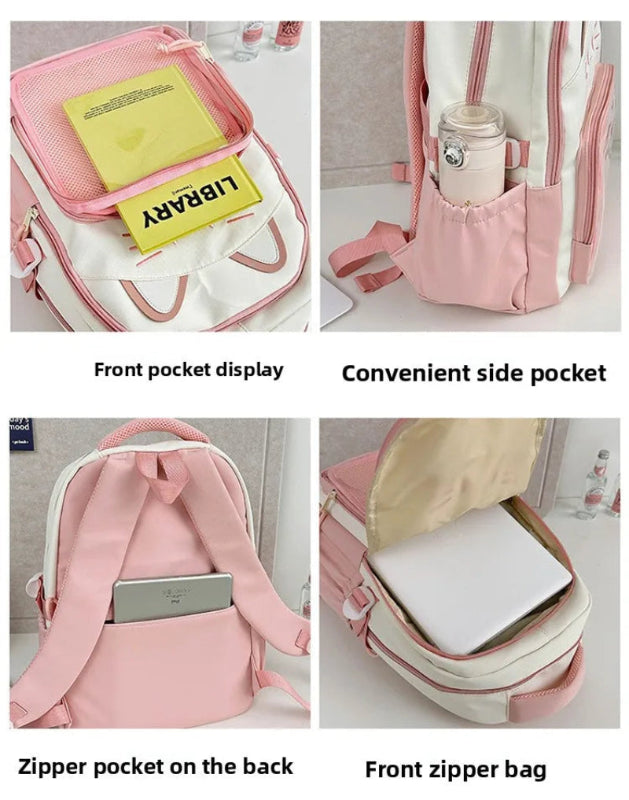 pink  neko backpack displayed by a white wall, showing the different storage compartments it has