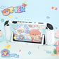 Gaming console with 'OTTER' themed cover on a blue background with cartoon otters and sea-themed decorations.