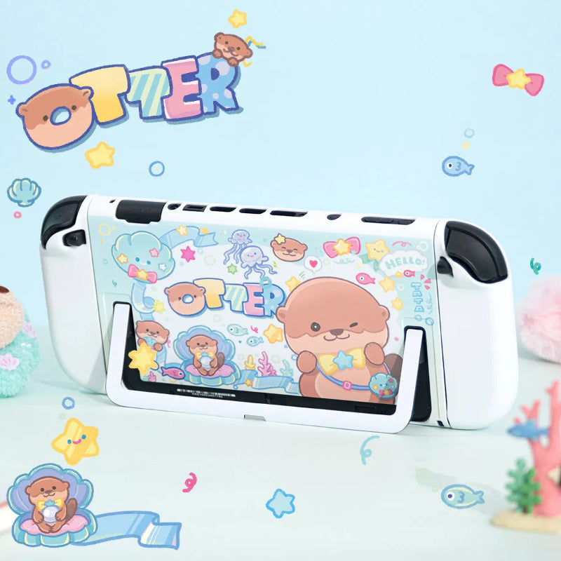 Gaming console with 'OTTER' themed cover on a blue background with cartoon otters and sea-themed decorations.