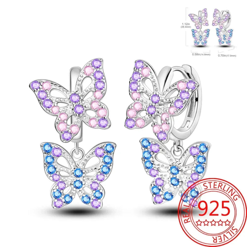 Butterfly earrings with colorful gemstones and a 'Sterling 925' stamp on a white background.