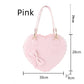 Heart-shaped pink bag with measurements on a white background