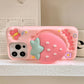 Rear view of Kawaii Sweet Strawberry Butterfly iPhone Case held on a shelf 