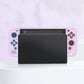 Gaming console with pink and purple design on a white background