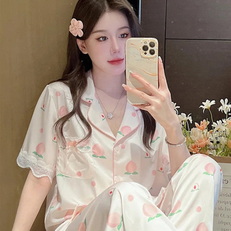 a woman posing in the Cute Peach Print Lace Trim Pajamas.