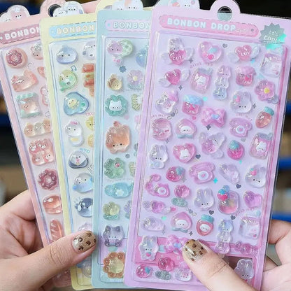 Set of colorful sticker sheets held by a person with visible nail polish.