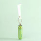 Green keychain frog fan on a light green background