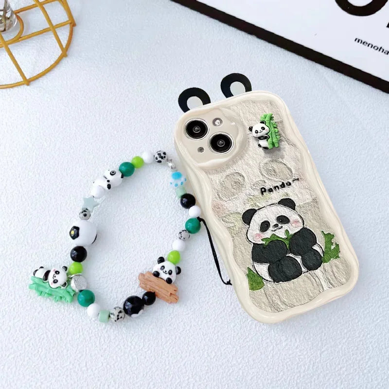 kawaii panda samsung phone white case with ears displaying a bamboo sat down eating bamboo on the case with a beaded phone charm attached on a white background