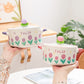 Kawaii purple and pink Flower Ramen Bowls featured by a woman holding the bowls with glass lids