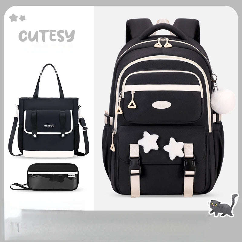 Black backpack with star designs and matching handbag on a light gray background, branded 'CUTESY'.