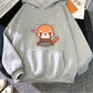 Gray hoodie with a red panda design on a textured surface