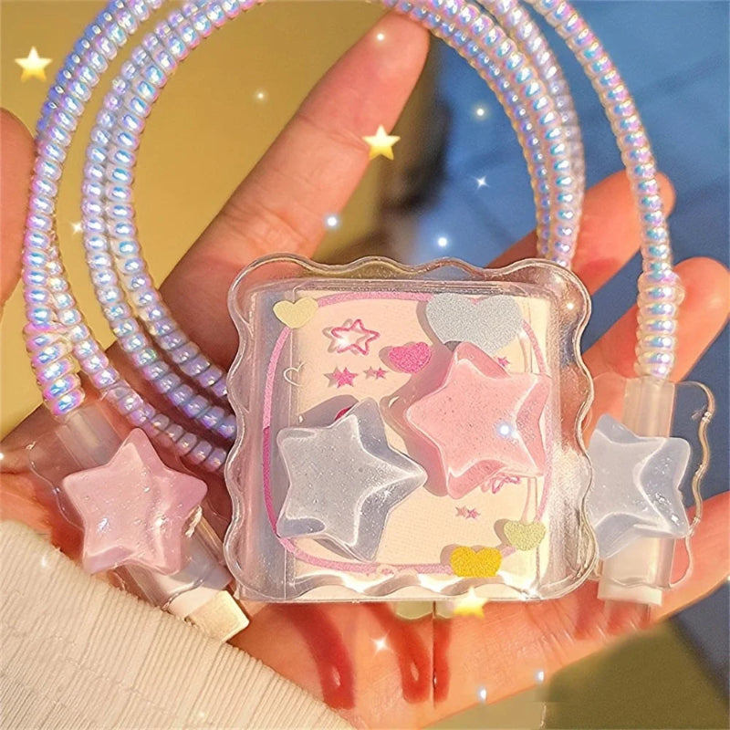 Star-shaped iphone charger cover with a clear case with stars held by a hand against a colorful background