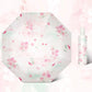 Floral-patterned umbrella on a light pink background