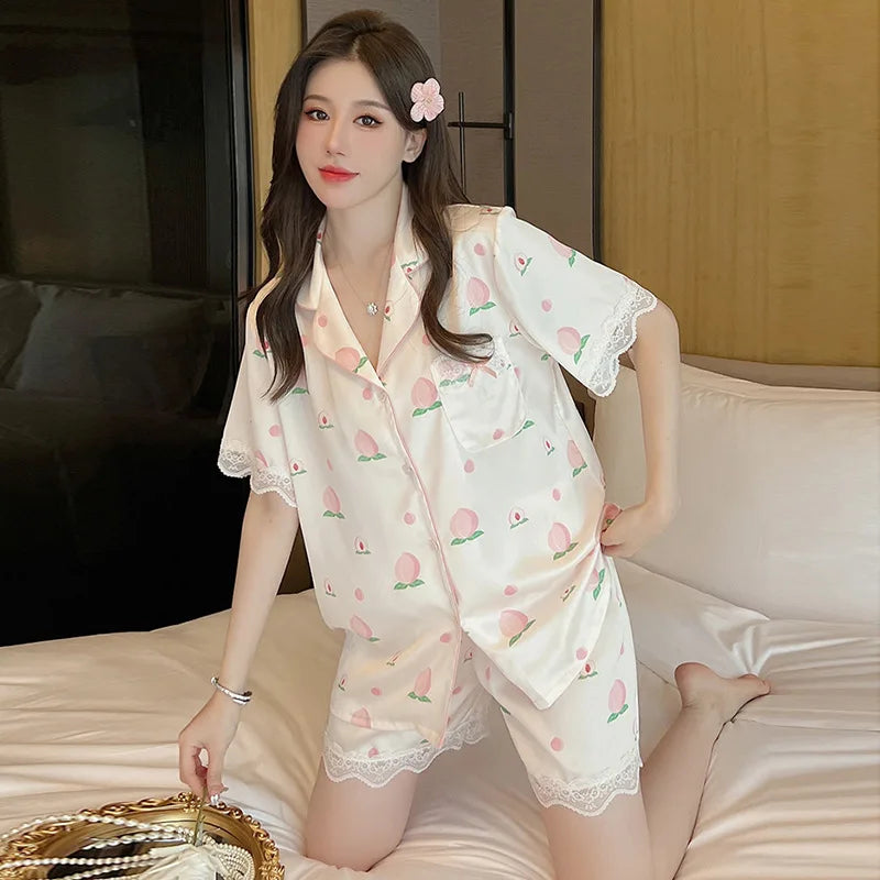  A woman wearing the Cute Peach Print Lace Trim Pajamas, this being the set that comes with shorts.