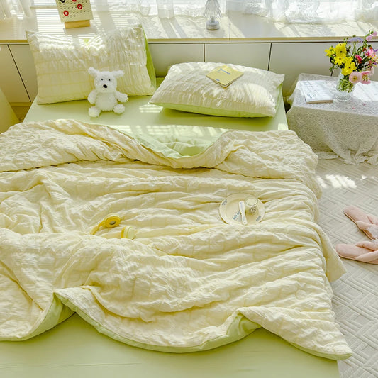 Green seersucker duvet set displayed on bed.