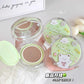 Makeup compact with green lid featuring a bear design on a light background