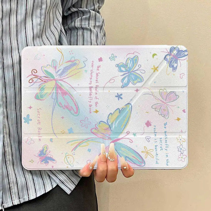 Person holding a ipad with a colorful butterfly design case against a beige background