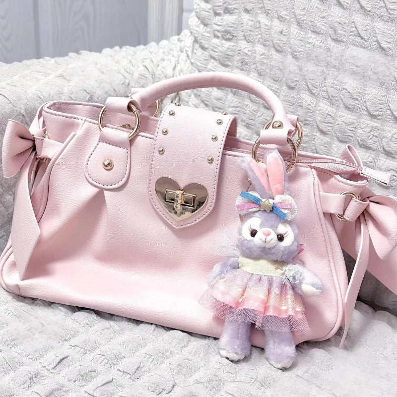 Kawaii Sweet Heart Lock Bag in Pink on a couch 