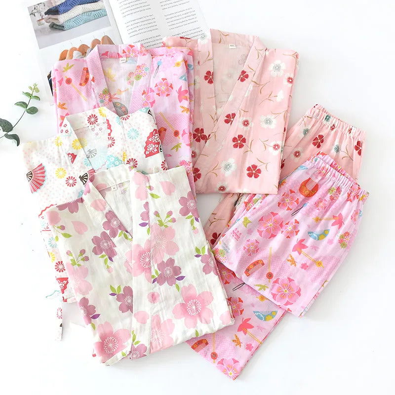 Set of pink floral pajama pants on a white background