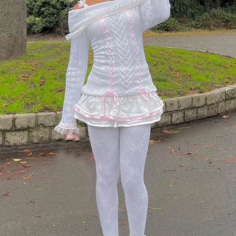 Front view of a Kawaii Coquette Off Shoulder Ribbon Sweater modeled by a woman in white