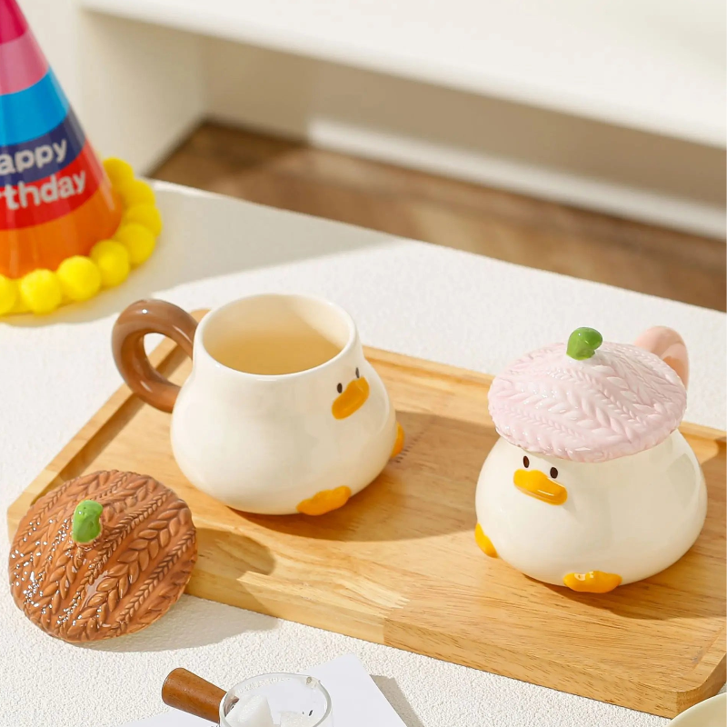 Kawaii Duck Mug with Lid on cutting board