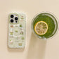 Kawaii Matcha Cake Phone Grip, this displays the case by itself that you can buy separately. next to an iced match drink.