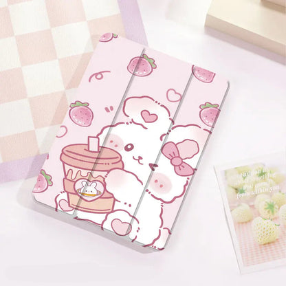kawaii Strawberry Bunny & Coffee iPad Case, this case depicts a bunny winking while holding a coffee in its paws, with strawberries raining down, the main color is pastel pink with a white rabbit. this case is displayed on a white desk top.