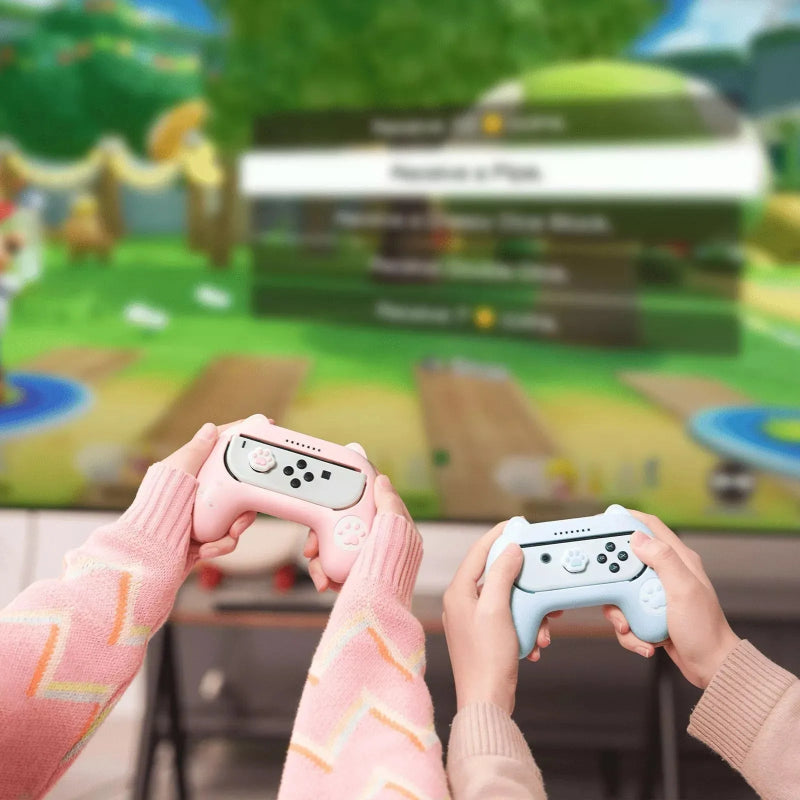 Two people playing a video game on a console with colorful controllers.